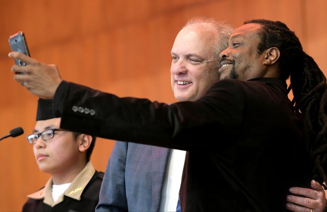Ike McBride, right, takes a selfie with Worcester Mayor Joseph Petty after being presented by the mayor with the MLK Jr. Youth Service Award at the 24th Annual Martin Luther King Jr. Youth Breakfast Saturday at Worcester State University. [T&G Staff/Steve Lanava]