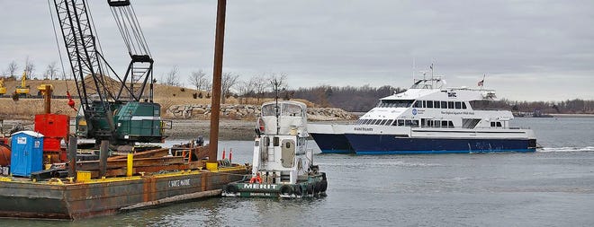 The Hingham commuter ferry Sanctuary arrives at the repaired dock in Hingham Harbor. The MBTA plans to resume service after being shut down for a week with ice damage to the dock. Sunday Jan. 14, 2018
