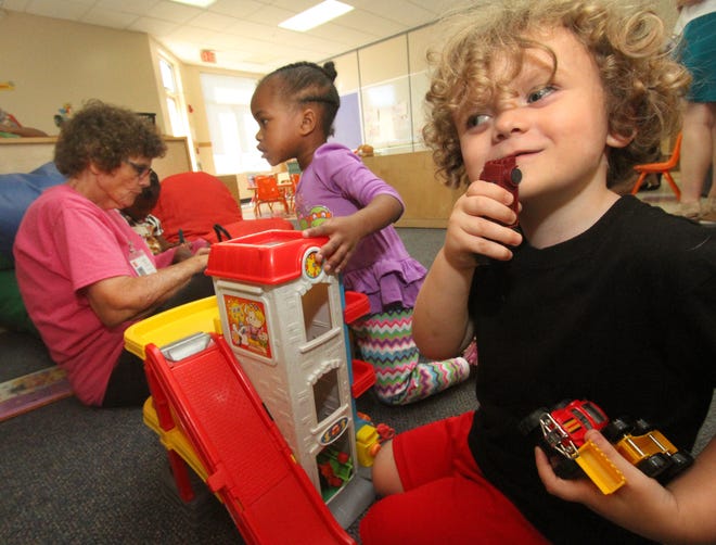 Carter Gould, at right, plays with preschooler Malysia Williams and teacher Bobbi Wood, Tuesday August 16, 2016 at the Easter Seals Charter School in Daytona Beach.  News-Journal/David Tucker