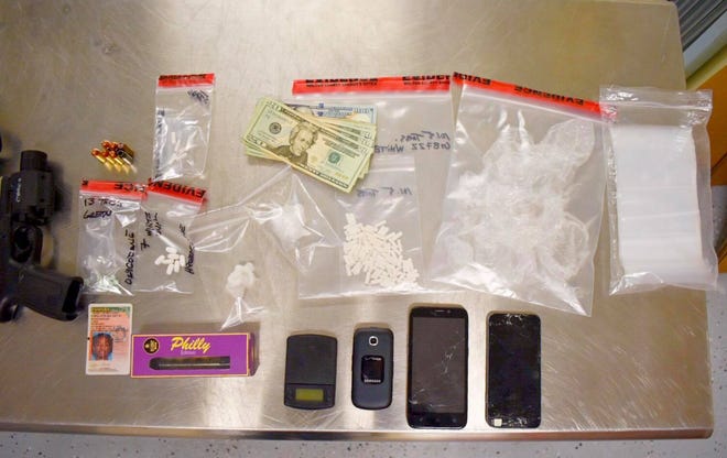 Deputies found a backpack containing approximately 110 Xanax bars, numerous oxycodone and hydrocodone pills, two bags of suspected powder cocaine, paraphernalia and a loaded Smith and Wesson handgun. [CONTRIBUTED PHOTO]