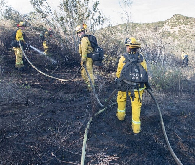 Authorities made an arrest in connection to a string of small fires started near the Interstate 15 and Interstate 215 interchange on Monday morning. [Photo courtesy of CalFire San Bernardino]