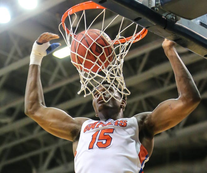 Florida center John Egbunu (15) dunks the ball against UNF during NCAA basketball action in the first round of the National Invitation Tournament (NIT) at the University of North Florida in Jacksonville, Fla., Tuesday, March 15, 2016. (The Florida Times-Union, Gary Lloyd McCullough)
