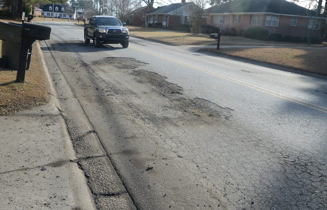 A large patch of broken pavement is seen along Hardee Road on Tuesday. [Janet S. Carter / The Free Press]