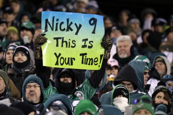 A Philadelphia Eagles' fan holds up a sign during the second half of an NFL divisional playoff football game against the Atlanta Falcons, Saturday, Jan. 13, 2018, in Philadelphia. (AP Photo/Chris Szagola)