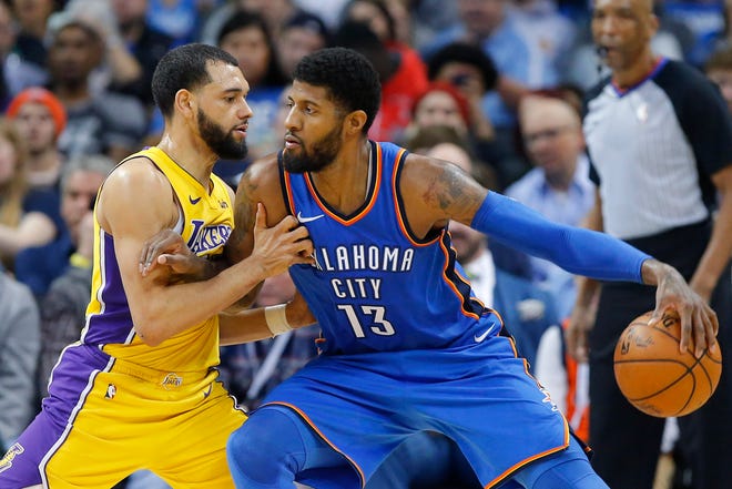 Oklahoma City's Paul George (13) tries to get past Los Angeles' Tyler Ennis (10) during an NBA basketball game between the Oklahoma City Thunder and the Los Angeles Lakers at Chesapeake Energy Arena in Oklahoma City, Wednesday, Jan. 17, 2018. Photo by Bryan Terry, The Oklahoman