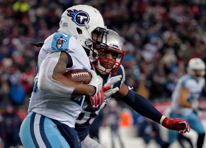 Patriots linebacker Marquis Flowers chases Tennessee Titans running back Derrick Henry during the second half of the divisional playoff Saturday night in Foxboro. In an earlier play that denied the Titans a chance to score in the second quarter, Henry was tackled for a loss on a fourth-and-1 play at the New England 46-yard line.