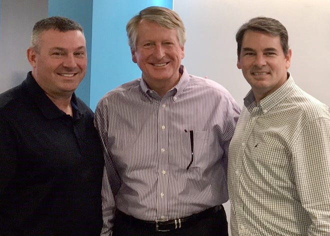 Steve Padgett, left, and Stu Henderson, right, have taken over ownership of the Fawley Bryant Architecture firm from co-founder Mike Bryant, middle. {PROVIDED PHOTO]