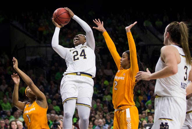 Notre Dame’s Arike Ogunbowale (24) goes up to shoot between Tennessee’s Anastasia Hayes (1) and Evina Westbrook (2) during their game Thursday in South Bend, Ind. (AP Photo/Robert Franklin)