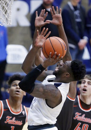 Akron's Daniel Utomi looks to score amid several Bowling Green defenders during the first half Saturday at James A. Rhodes Arena in Akron. Akron won the game 80-78. (Karen Schiely/Beacon Journal/Ohio.com)