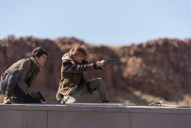 Thomas (Dylan O’Brien) and Newt (Thomas Brodie-Sangster) fend off the bad guys. [20th Century Fox]