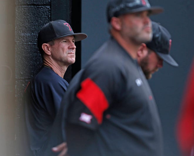 Texas Tech coach Tim Tadlock watches the game from the dugout during an NCAA college baseball regional against Delaware, Friday, June 2, 2017, in Lubbock, Texas. (Brad Tollefson/Lubbock Avalanche-Journal)