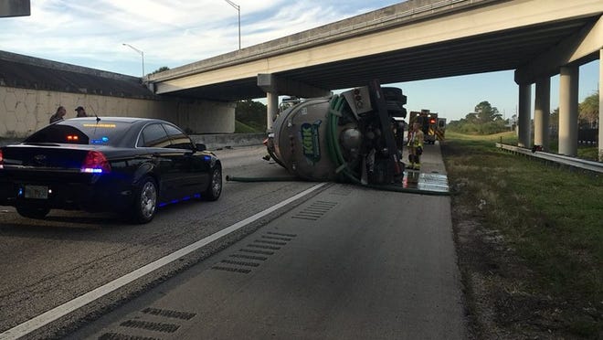 All northbound lanes of Florida’s Turnpike were blocked near Palm City after a septic tank truck overturned. One person sustained a minor injury. (Photo by Martin County Sheriff’s Office).