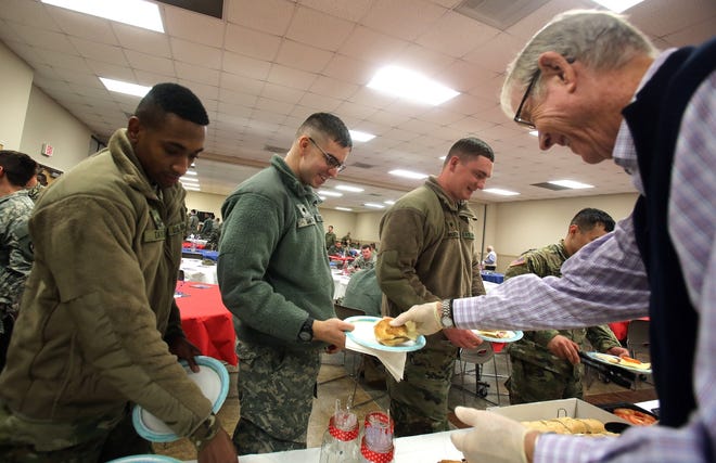 Jay Rhodes serves members the 878th National Guard Engineering Company at the Patrick Senior Center in Kings Mountain on Thursday. [Brittany Randolph/The Star]