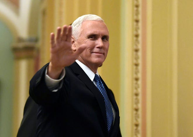 FILE - In this Jan. 3, 2018, file photo, Vice President Mike Pence waves as he walks on Capitol Hill in Washington. Pence is making his fifth visit to Israel, returning to a region he’s visited “a million times” in his heart. An evangelical Christian with strong ties to the Holy Land, Pence this time comes packing two key policy decisions in his bags that have long been top priorities for him: designating Jerusalem as Israel’s capital and curtailing aid for Palestinians.(AP Photo/Susan Walsh, File)