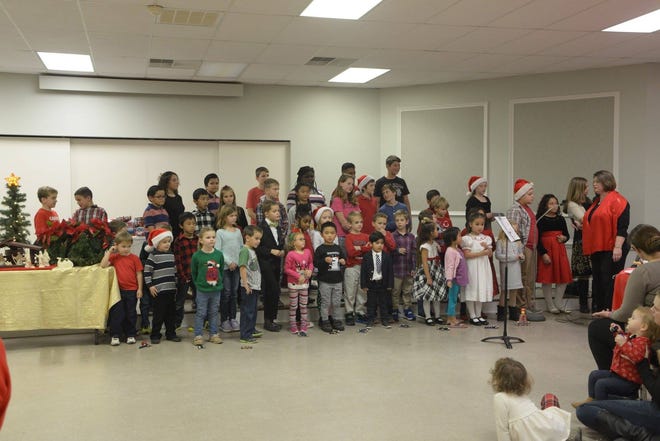 The Knights of Columbus Annual Christmas Party provided children and grandchildren of the local knights an early Christmas celebration. Grand Knight Philip Nassef presided over the ceremonies aided by elves Liz Dallesandro and Pat Baader. [CONTRIBUTED PHOTO]