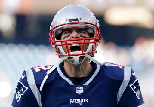 New England Patriots quarterback Tom Brady gives a shout as he takes the field to warm up before the AFC championship NFL football game against the Jacksonville Jaguars, Sunday, Jan. 21, 2018, in Foxborough, Mass. (AP Photo/Charles Krupa)