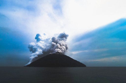 In this photo provided by Brenton-James Glover, ash plumes rise from the volcano on Kadovar Island, Papua New Guinea in the South Pacific Sunday, Jan. 21, 2018. The island volcano erupted again Sunday, sending plumes of steam and ash into the air. Thousands of people have been evacuated from islands surrounding Kadovar Island off the South Pacific nation's north coast since the volcano there began erupting on Jan. 5. (Brenton-James Glover via AP)