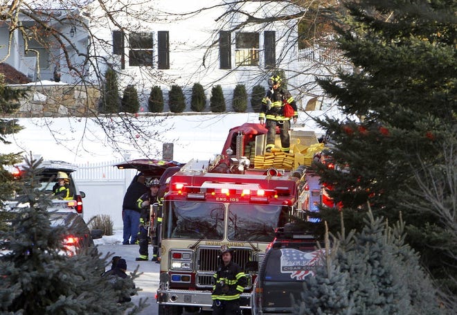Firefighters work at the scene of a small fire on a property at the home of former President Bill Clinton and his wife Hillary Clinton, Wednesday, Jan. 3, in Chappaqua, N.Y. A Clinton spokesman tweeted that the fire was in a building used by the Secret Service, not in the Clintons' residence. He also said the Clintons were not home at the time and "all is OK!" [ FRANK BECERRA JR. / THE JOURNAL NEWS ]