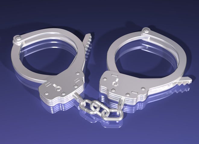 Illustration of a pair of silver handcuffs on a blue background