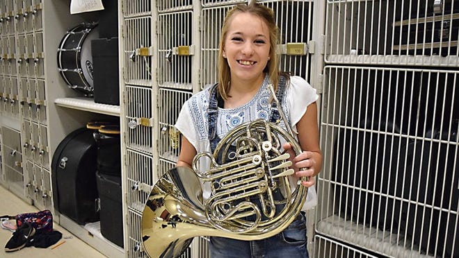 Smithville High School junior Hailey Sherrill holds her French horn, the instrument that helped her earn a third All-State Band award. FRAN HUNTER/FOR SMITHVILLE TIMES
