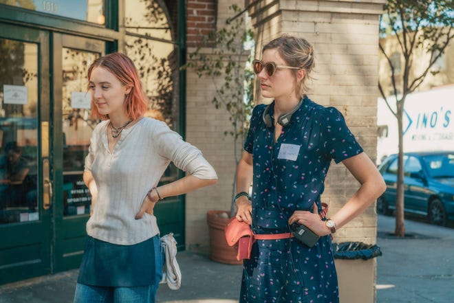 This image released by A24 Films shows director Greta Gerwig, right, and Saoirse Ronan on the set of “Lady Bird.” Gerwig is expected to be the fifth woman nominated for an Oscar for best director when the nominations for the 90th annual Academy Awards are announced on Tuesday. (Merie Wallace/A24 via AP)