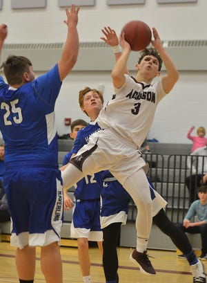 Addison guard Adam Chilson puts up a shot against Bath Tuesday in Addison. [ERIC WENSEL/THE LEADER]