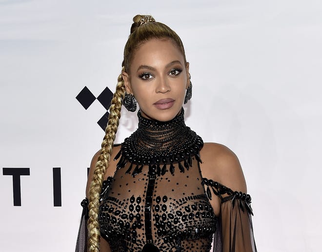 In this Oct. 15, 2016 file photo, singer Beyonce Knowles attends the Tidal X: 1015 benefit concert in New York. Some of the nation's largest recording studios have joined forces in an effort to stop Fit Radio, a music streaming service aimed at fitness enthusiasts, from using songs by Beyonce, Justin Bieber, Green Day and other stars. A representative of the Atlanta firm said in a statement Tuesday, Jan. 23, 2018, that it looks forward to "being vindicated by the court system." (Photo by Evan Agostini/Invision/AP, File)