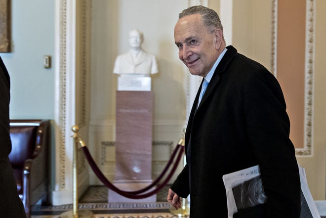 Senate Minority Leader Chuck Schumer, D-N.Y., walks to his office at the U.S. Capitol in Washington on Jan. 22, 2018. [Bloomberg / Andrew Harrer]