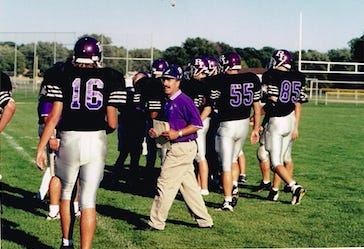 Rich Infusino (in purple polo shirt) took Lutheran to the playoffs in two of his four years as the Crusaders' head coach. He has retired after 44 years as a local football coach. He also coached baseball for 39 years and wrestling for eight. [PHOTO PROVIDED]