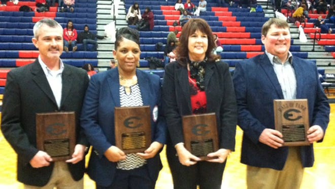 From left, Effingham County High School’s 2018 Hall of Fame inductees Milton Douglas Morgan, Joyce Ann Wright Eason, Victoria B. Little and John Brandon Long are honored at the halftime of the Rebels’ basketball game against Glynn Academy Friday night. (Donald Heath/For Effingham Now)