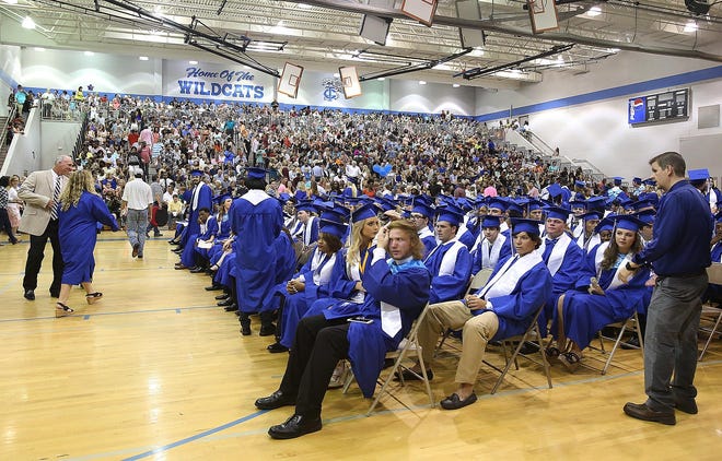 Graduates wait in the gymnasium as family and friends make their way from the football stadium into the school after rain began to fall at Tuscaloosa County High School in Northport, Ala. on Thursday May 12, 2016. Staff photo | Erin Nelson