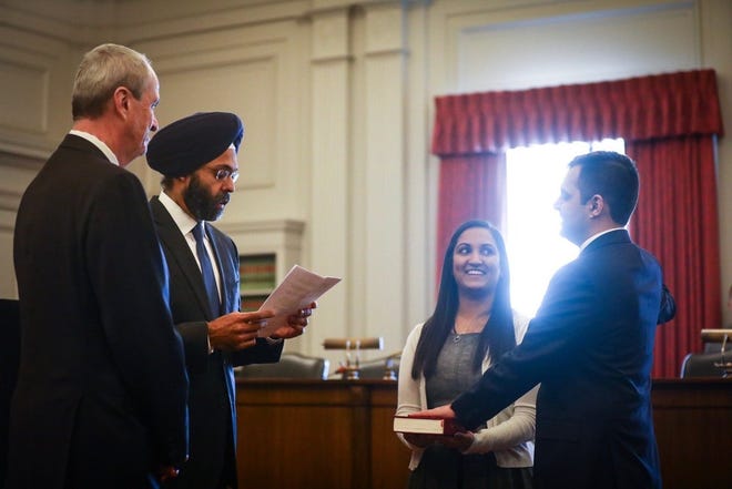 Gov. Phil Murphy looks on as New Jersey Attorney General Gurbir Grewal swears in Mount Laurel resident Parthiv Patel as a member of the New Jersey State Bar Association. Patel is believed to be the first Dreamer immigrant to be admitted to the association. [PHOTO COURTESY OF NJ GOVERNOR'S OFFICE]