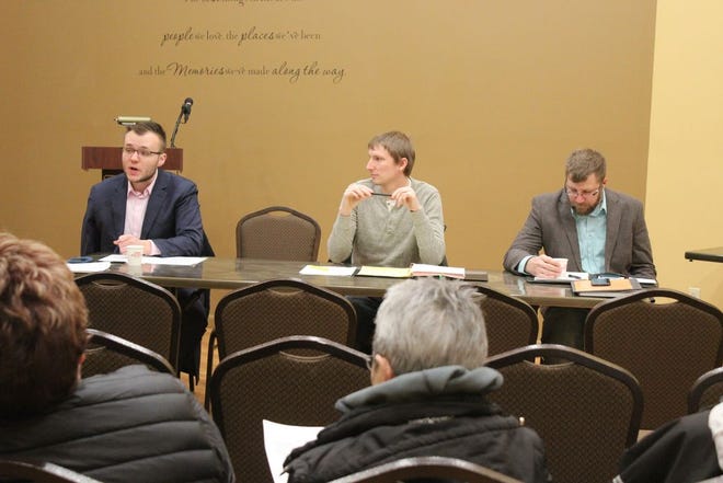 Lucas Wakefield (left) chairs the Ramsey County Home Rule Commission. He is joined at the table by Anthony Herman and Adam Leiphon.