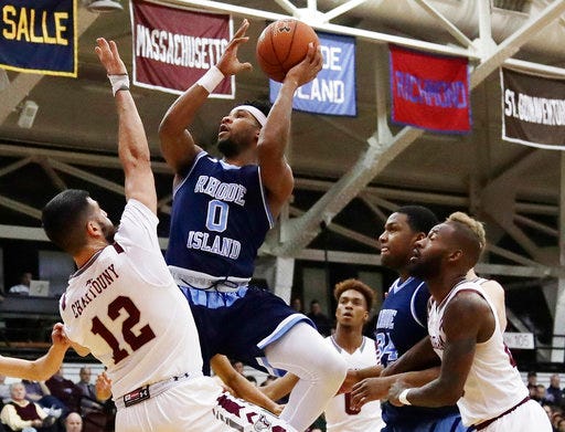 Rhode Island's E.C. Matthews (0) shoots over Fordham's Joseph Chartouny (12) during the first half of an NCAA college basketball game Wednesday, Jan. 24, 2018, in New York. (AP Photo/Frank Franklin II)