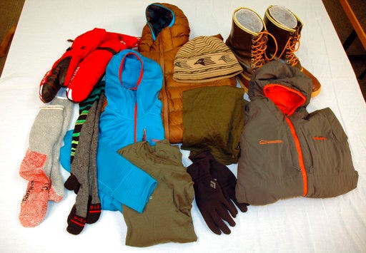 This Jan. 10, 2018 image shows basic apparel for dressing in layers for winter, in Minneapolis. The gear was supplied by Midwest Mountaineering, an outdoor gear store in Minneapolis. Steve Schreader, who works there, says layering is the key to staying warm and comfy in cold weather, whether you're attending a tailgate party in Minneapolis for Super Bowl or any other outdoor recreation. (AP Photo/Jeff Baenen)
