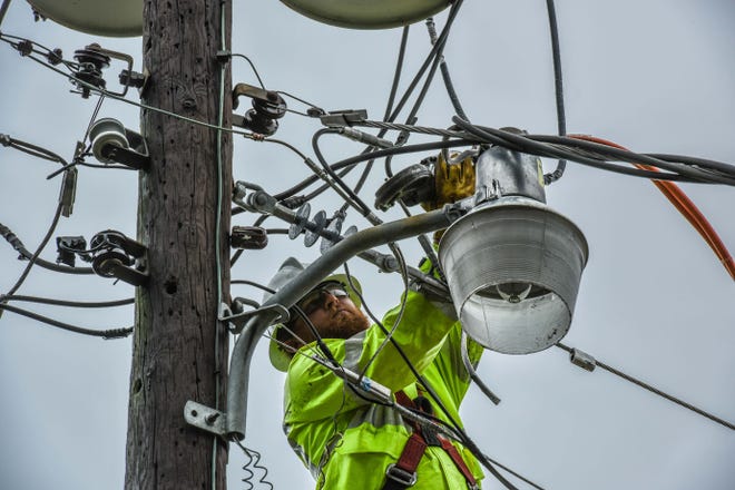 A Gulf Power employee works on a line in Destin after Hurricane Nate moved through Northwest Florida. [GULF POWER/CONTRIBUTED PHOTO]
