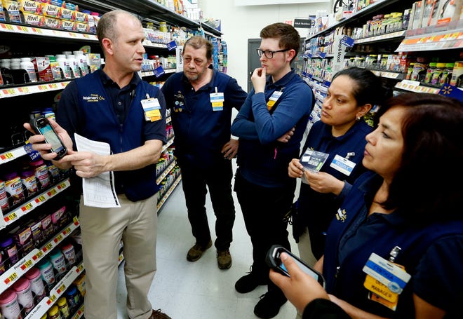 Belle Isle Walmart trainer Kevin Early, far left, teaches a class to employees, from left, Lloyd Sanders, Andrew Holman, Regina Aguinaga and Cynthia Serbin. [Photo by Steve Sisney, The Oklahoman]