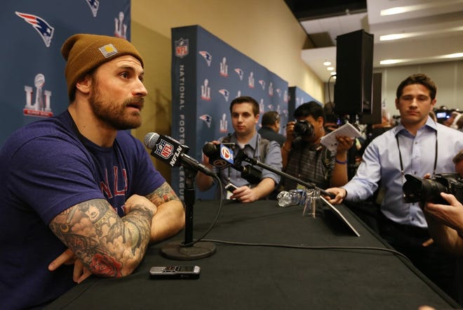 Patriots defensive lineman Chris Long talks to the media at Super Bowl LI.