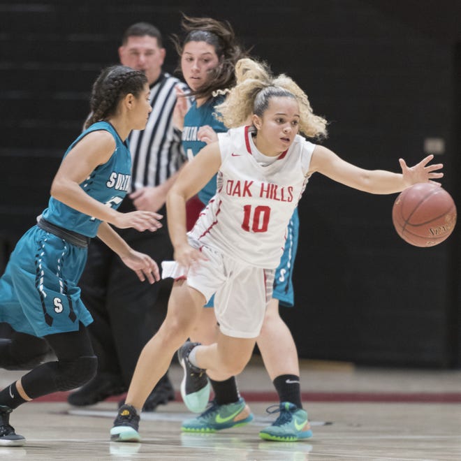 Oak Hills' Jessikah Alvarado steals the ball from a Sultana player Wednesday. Alvarado had a double-double to lead the Bulldogs to a 56-22 victory. [James Quigg, Daily Press]
