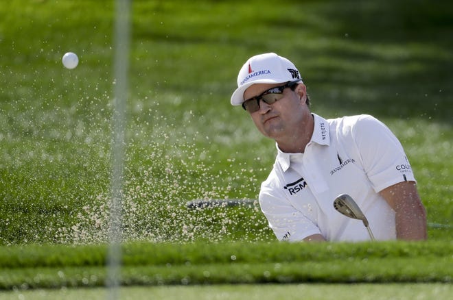 Zach Johnson hits from the bunker on the fourth hole during the first round of the CareerBuilder Challenge at La Quinta Country Club on Jan. 18 in La Quinta, Calif. [AP Photo / Chris Carlson]