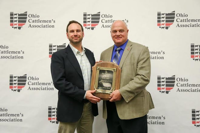 Ohio Rep. Brian Hill, r, was honored with the Industry Service Award at the OCA Banquet. He is pictured with Matt Reese of Ohio’s Country Journal.