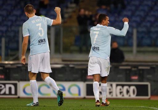 Lazio's Nani, right, celebrates with his teammate Stefan de Vrij after scoring during the Serie A soccer match between Lazio and Udinese, at the Rome Olympic stadium Wednesday, Jan. 24, 2018. (AP Photo/Gregorio Borgia)