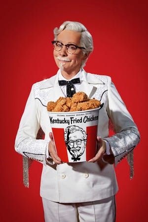 This photo provided by KFC shows singer Reba McEntire as KFC's Colonel Sanders. A rotating cast of famous names have portrayed the Colonel since 2015, but McEntire is the first female celebrity to do it, and the first musician. (Courtesy of KFC via AP)