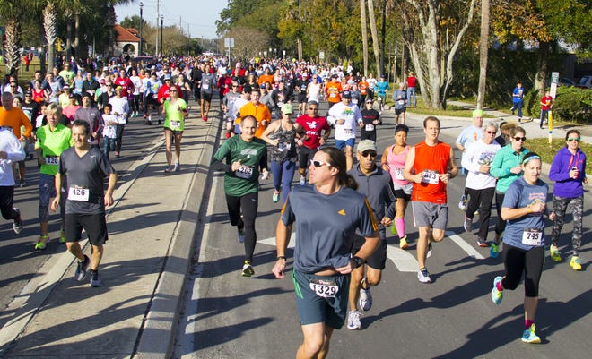 More than 1,100 runners leave the starting line during the 36th annual Matanzas 5K on, Jan. 30, 2016. [Gary LeVeille/Correspondent]