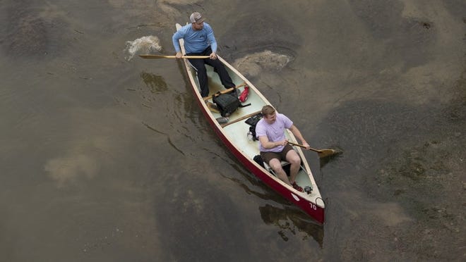 Paddlers in canoes and kayaks compete Jan. 20 in the Texas Winter 100, racing from Austin to Bastrop on the Colorado River. Stephen Spillman for American-Statesman