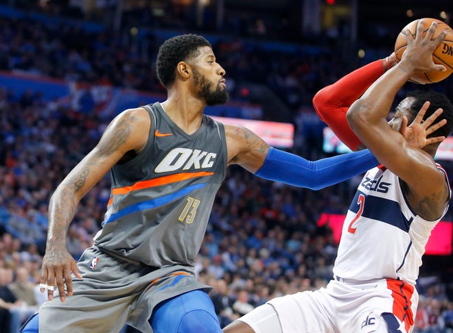 Oklahoma City's Paul George (13) defends Washington's John Wall (2) during a game between the Thunder and the Wizards in at Chesapeake Energy Arena on Jan. 25, 2018. [Photo by Bryan Terry, The Oklahoman]