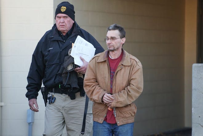Brian Shane Shatzer, Waynesboro, right, is escorted out of the Waynesboro Police Department by Constable Mike Cermak Sr. late Friday afternoon. Shatzer was charged with drug delivery resulting in an overdose death in Waynesboro last September.