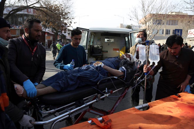 An injured man is moved on a stretcher outside a hospital following a suicide attack in Kabul, Afghanistan, Saturday Jan. 27, 2018. A suicide car bomber killed at least 40 people and wounded about 140 more in an attack claimed by the Taliban on Saturday in Afghanistan’s capital Kabul, authorities said. (AP Photo/ Rahmat Gul)