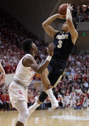Purdue's Carsen Edwards (3) shoots over Indiana's Aljami Durham in the first half of Sunday's game. [Darron Cummings/The Associated Press]