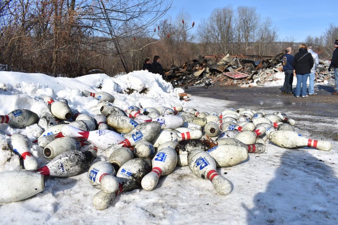 Bowling pins lay in a pile in the snow after the four-alarm file at Minisink Lanes in Huguenot on Jan. 20. [TIMES HERALD-RECORD FILE PHOTO]
